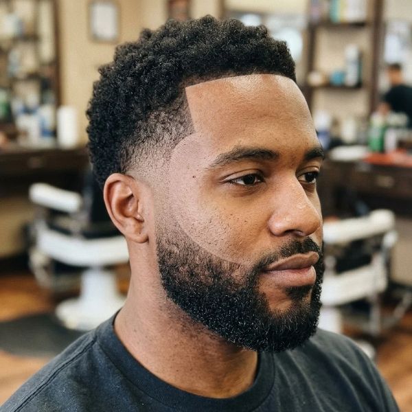 Low taper fade with a beard and line-up